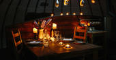 Enjoy a romantic candelit dinner at The Slades tent at Penhein Glamping in Monmouthshire