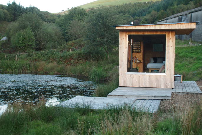 Exterior of Caban Cilfa by the pond at Beudy Banc in Wales
