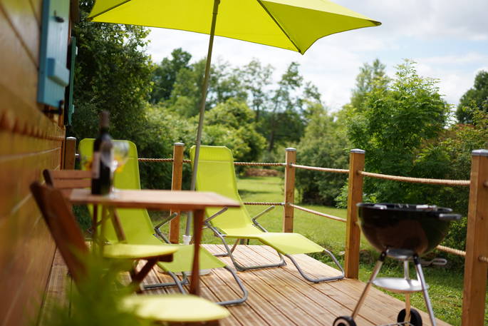 Lounge of the deck outside Rozanne roulotte at Coutillard in France 