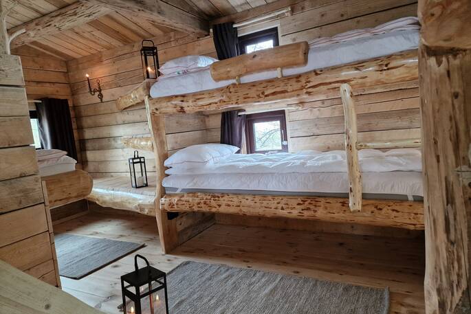 Room with three bunk beds