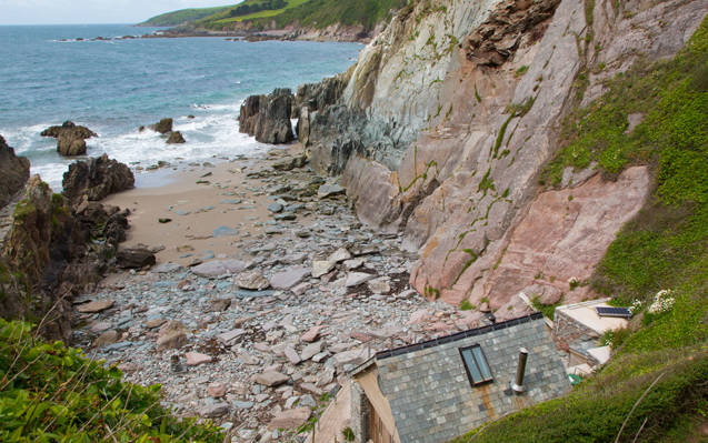 Carswell Beach Hut situated within its own private cove on the South Devon coast